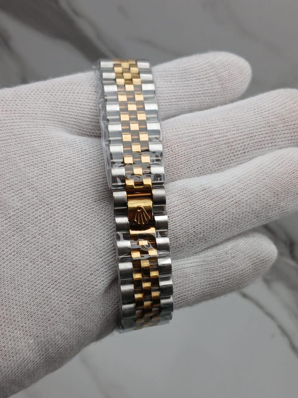 Two-Tone GMT-Style Luxury Wristwatch with Green & Black Bezel