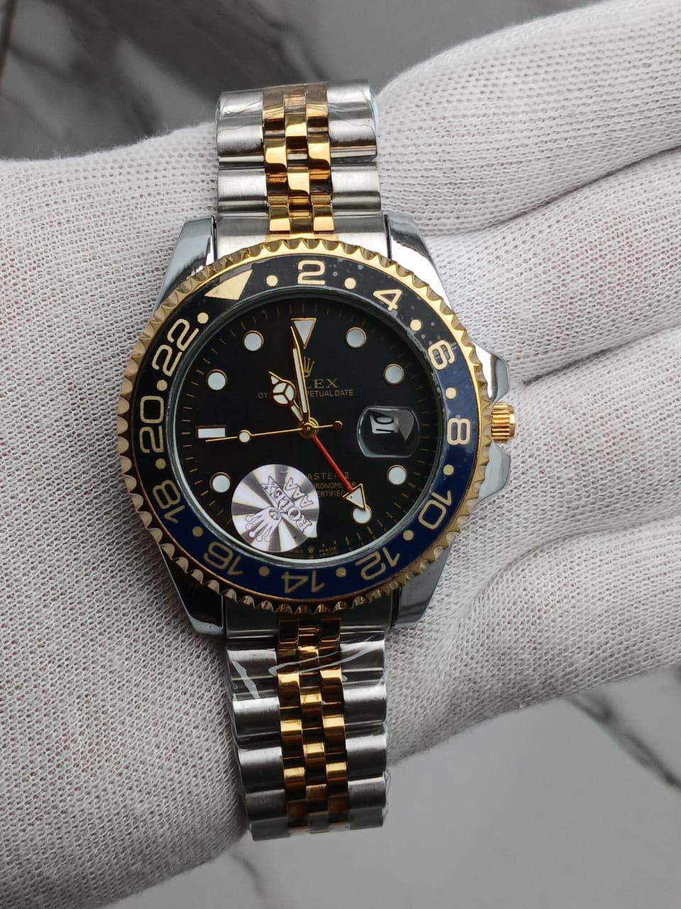 Two-Tone GMT-Style Luxury Wristwatch with Green & Black Bezel
