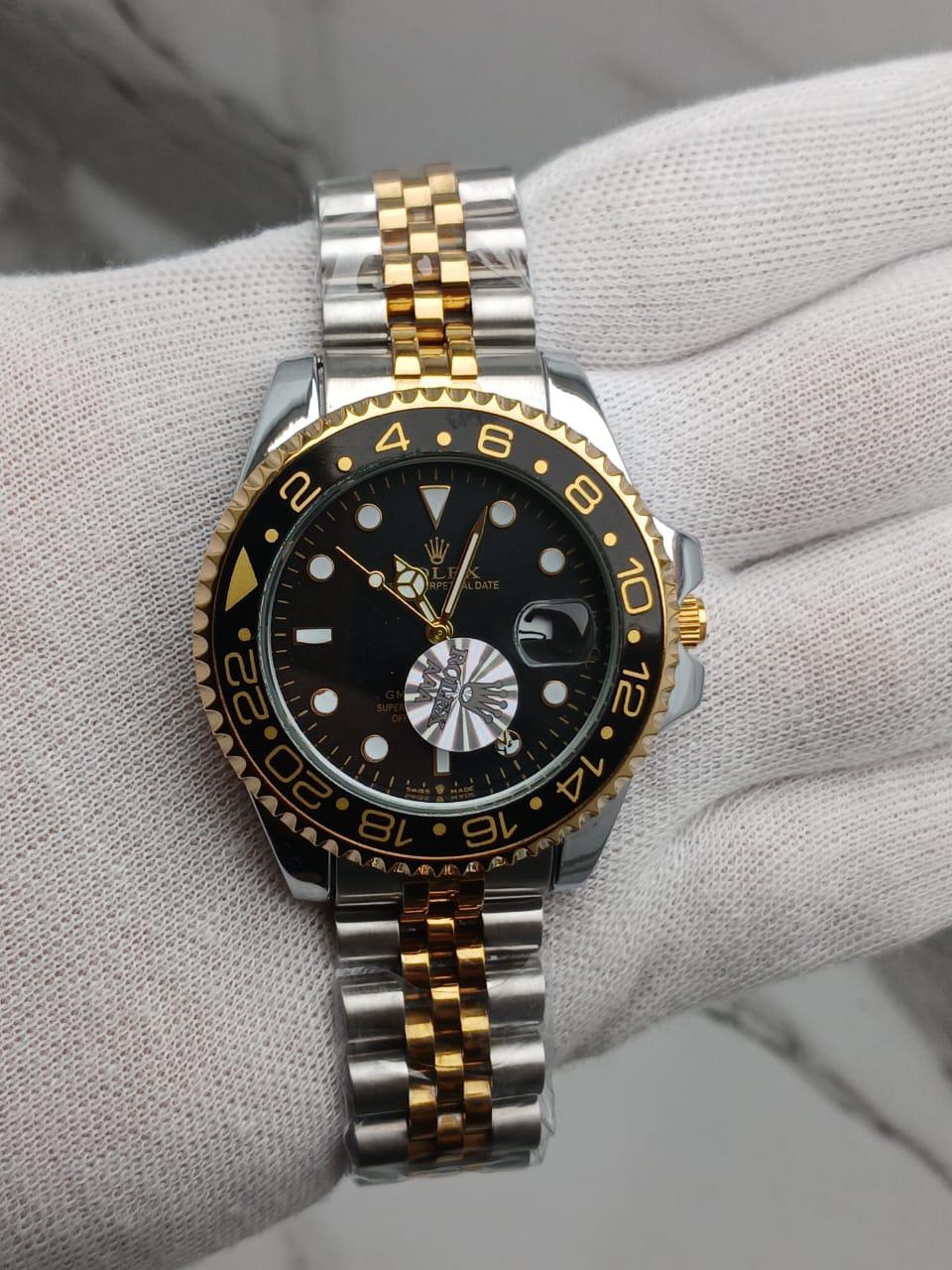 Two-Tone GMT-Style Luxury Wristwatch with Green & Black Bezel